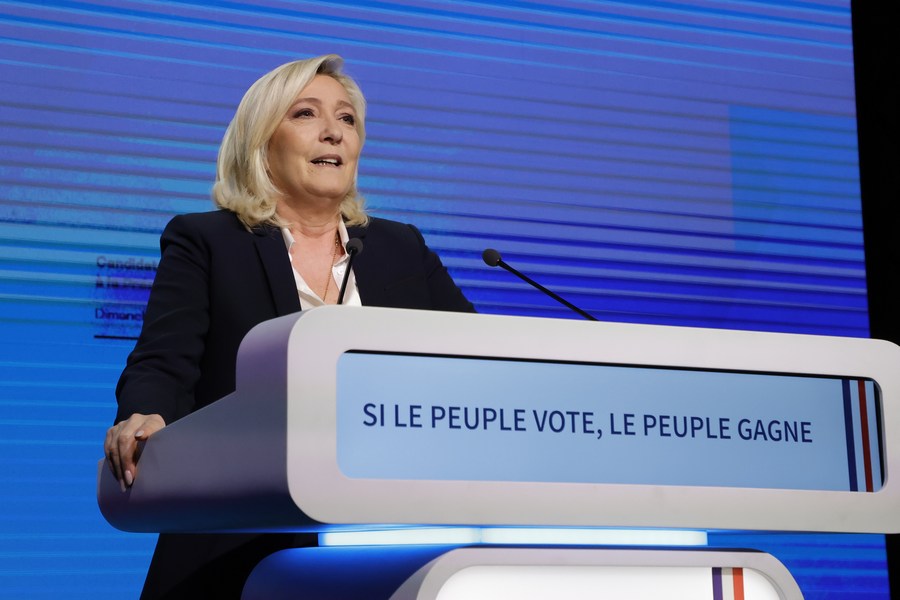 French far-right National Rally party candidate Marine Le Pen delivers a speech at a rally after the first round of French presidential election in Paris, France, on April 10, 2022.  (Photo by Rit Heize/Xinhua)