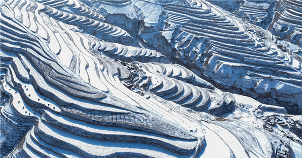 Terraced fields covered in snow resembles ‘fingerprints of Earth’