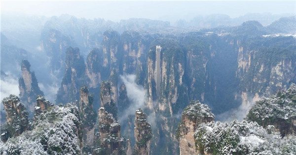 Rime covered rock pillars stretch up to sky in land of 'Avatar'