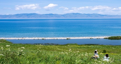 Clear Sayram Lake welcomes vibrant Summer