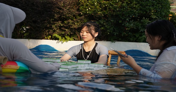 Chongqing locals play Mahjong in water as orange heat alert continues