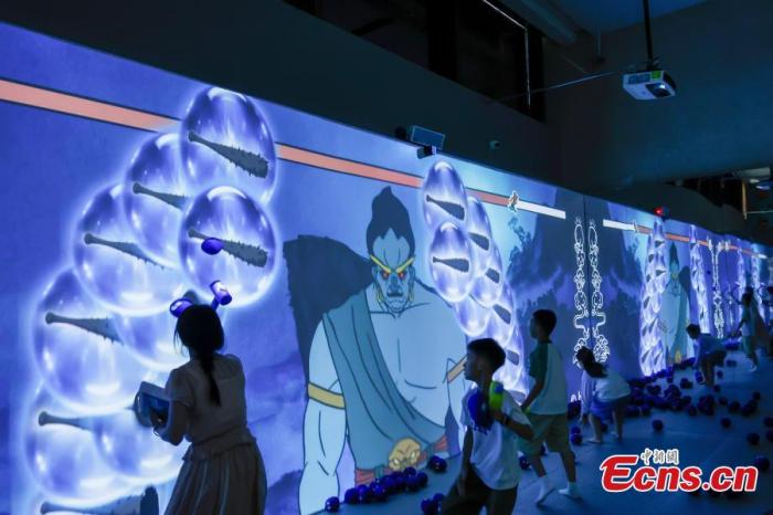 Visitors interact with a large screen at the themed exhibition of the film "The Little Monsters of Langlang Mountain" in Hangzhou, Zhejiang Province, Aug. 5, 2025. (Photo/China News Service) Visitors interact with a large screen at the themed exhibition of the film "The Little Monsters of Langlang Mountain" in Hangzhou, Zhejiang Province, Aug. 5, 2025. (Photo/China News Service)