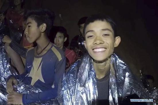 Trapped young footballers are seen in the cave in Chiang Rai, Thailand, July 4, 2018. (Xinhua)