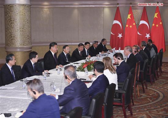 Chinese President Xi Jinping meets with his Turkish counterpart Recep Tayyip Erdogan in Johannesburg, South Africa, July 26, 2018. (Xinhua/Yan Yan)