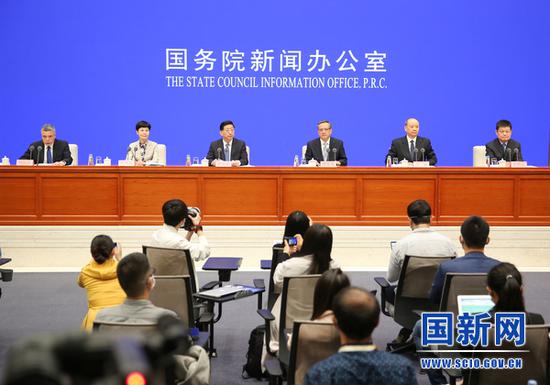 NHC officials speak at a news conference at the State Council Information Office in Beijing on May 15, 2020. /SCIO