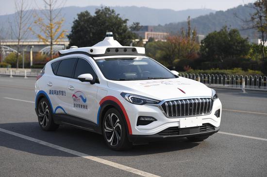 A self-driving robotaxi developed by Chinese search provider and artificial intelligence (AI) heavyweight Baidu and Chinese carmaker FAW Hongqi participates in a test ride for seed passengers in Changsha, central China's Hunan Province, Dec. 6, 2019. (Xinhua/Xue Yuge)