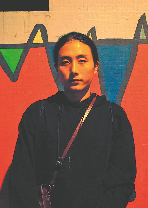 Portrait of the photographer who received no formal training and maintains a day job. [Photo provided to China Daily]