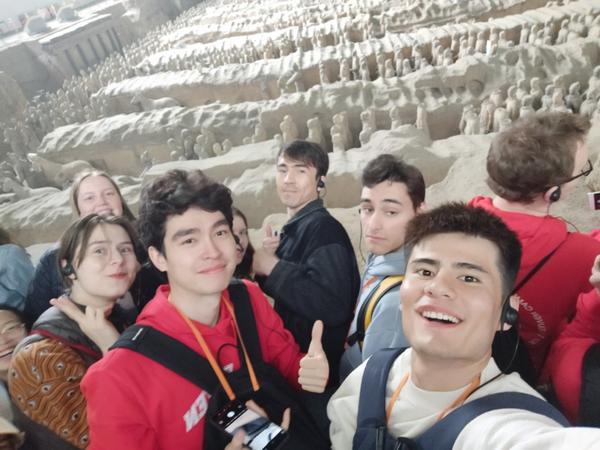 Hasanbayev Agabek (front row, right), a student from Turkmenistan, visits the Emperor Qinshihuang's Mausoleum Site Museum. [Photo provided to chinadaily.com.cn]