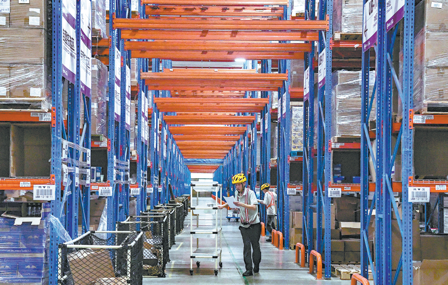  Employees sort goods at a cross-border e-commerce logistics center in Jinhua, Zhejiang province, in preparation for the upcoming shopping gala. SHI KUANBING/FOR CHINA DAILY
