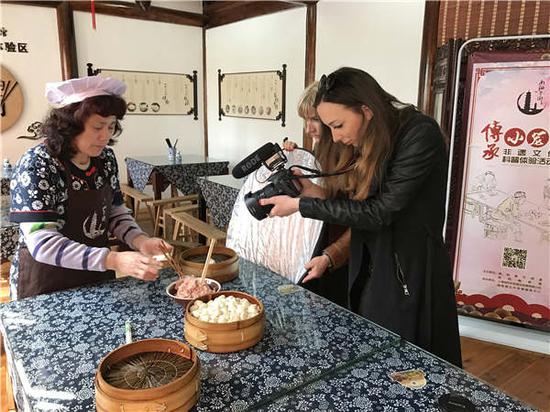 Adele Lengyel shooting the making of steamed buns. (Photo provided to China Daily)