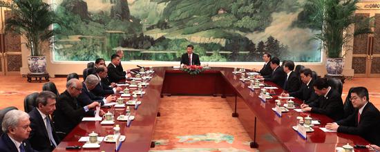 President Xi Jinping meets with heads of foreign delegations attending the 13th meeting of Security Council Secretaries of the Shanghai Cooperation Organization at the Great Hall of the People in Beijing on Tuesday. He called for moving SCO security cooperation forward to a new level. (WU ZHIYI / CHINA DAILY)