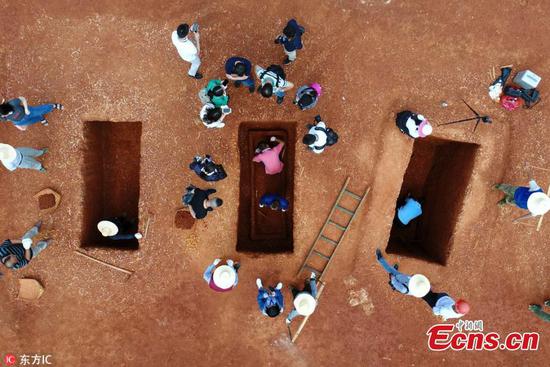 Photo taken on May 8, 2018 shows archeologists at work at tombs found in a former factory in Yiyang City, Central China's Hunan Province. The Hunan Provincial Archelogy Institute held an open day to show the progress made in the excavation since Dec. 2017. (Photo/IC)