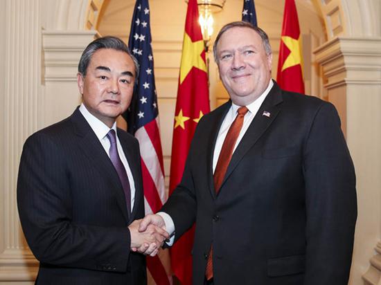 State Councilor and Foreign Minister Wang Yi and US Secretary of State Mike Pompeo meet in Washington on Wednesday. (Photo/Xinhua)