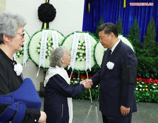 Xi Jinping shakes hands with a family member of Sun Fuling, former vice chairman of the National Committee of the Chinese People's Political Consultative Conference (CPPCC), at Babaoshan Revolutionary Cemetery in Beijing, capital of China, May 24, 2018. The body of Sun was cremated Thursday here. Xi Jinping, Li Keqiang, Li Zhanshu, Wang Yang, Wang Huning, Zhao Leji, Han Zheng as well as other senior officials paid their final respects to Sun. (Xinhua/Xie Huanchi)