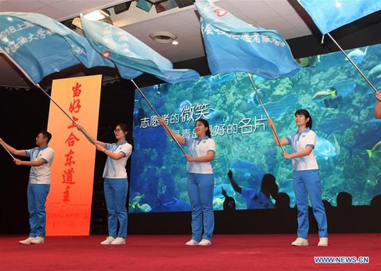 Volunteers attend a launch ceremony for the volunteer program for the upcoming Shanghai Cooperation Organization (SCO) summit in Qingdao, east China's Shandong Province, May 24, 2018. About 2,000 volunteers will offer services such as assisting with guests' arrival and departure, translation, and media requests during the 18th summit of the SCO. (Xinhua/Li Ziheng)