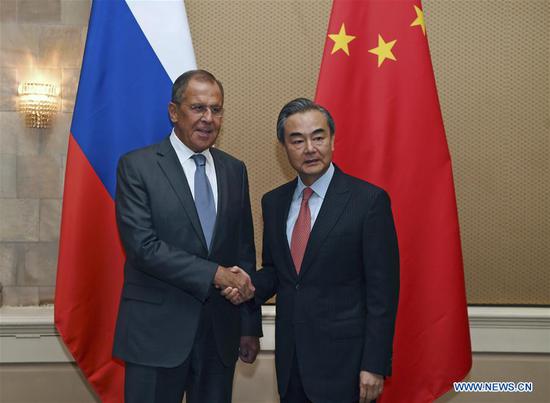 Chinese State Councilor and Foreign Minister Wang Yi (R) meets with Russian Foreign Minister Sergei Lavrov on the sidelines of the Formal Meeting of the BRICS Ministers of Foreign Affairs, in Pretoria, South Africa, June 3, 2018.  (Xinhua/Chen Cheng) 