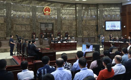 Zhang Wenzhong, founder and former chairman of Wumei Holdings, is pronounced not guilty at the Supreme People's Court on Thursday, reversing a decade-old verdict. (XU LIXIN/XINHUA)