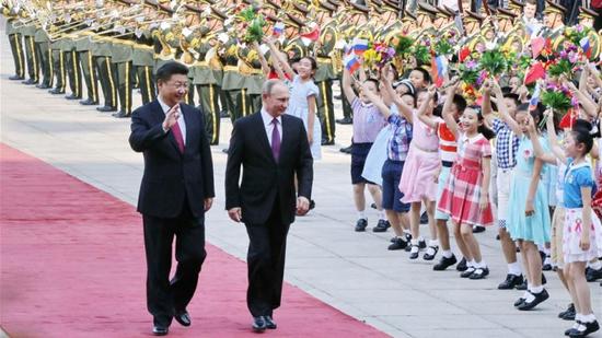 June 25, 2016: Chinese President Xi Jinping (L) holds a welcoming ceremony for Russian President Vladimir Putin before their talks at the Great Hall of the People in Beijing, China. /Xinhua Photo