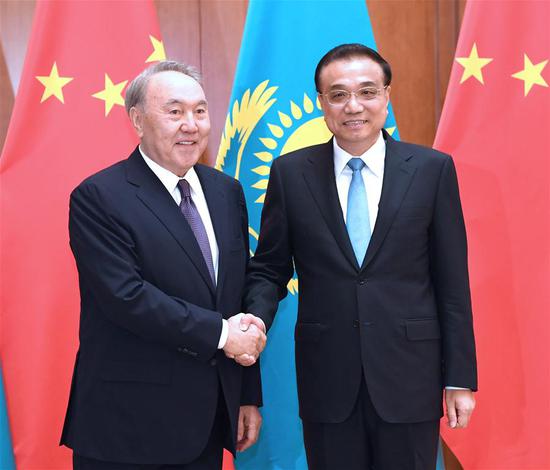 Chinese Premier Li Keqiang (R) meets with Kazakh President Nursultan Nazarbayev, who is in China on a state visit and to attend the Shanghai Cooperation Organization Qingdao Summit, in Beijing, capital of China, June 7, 2018. (Xinhua/Rao Aimin)