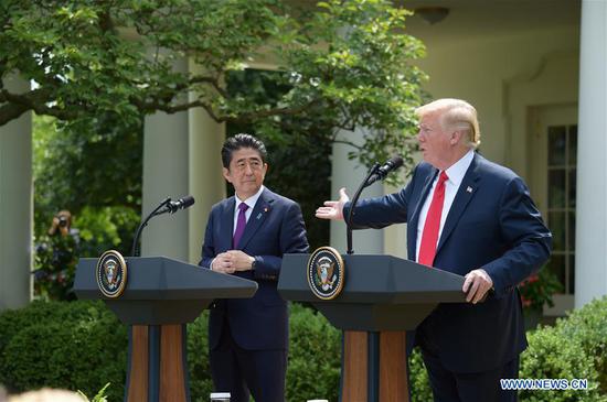 U.S. President Donald Trump (R) and Japanese Prime Minister Shinzo Abe attend a joint press briefing at the White House in Washington D.C., the United States, on June 7, 2018. (Xinhua/Yang Chenglin)