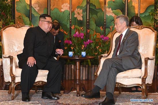 Singaporean Prime Minister Lee Hsien Loong (R) meets with Kim Jong Un, chairman of the Workers' Party of Korea (WPK) and chairman of the State Affairs Commission of the Democratic People's Republic of Korea (DPRK), in Singapore, on June 10, 2018. (Xinhua/Then Chih Wey)