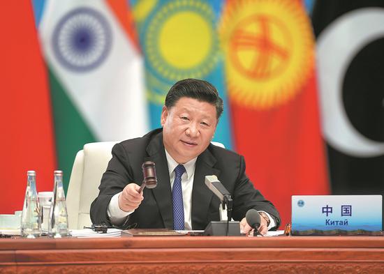 President Xi Jinping presides over a plenary session of the 18th Shanghai Cooperation Organization Summit in Qingdao, Shandong Province, on Sunday. (Photo/Xinhua)