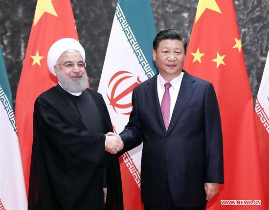 Chinese President Xi Jinping (R) holds talks with his Iranian counterpart Hassan Rouhani in Qingdao, east China's Shandong Province, June 10, 2018. (Xinhua/Ding Lin)