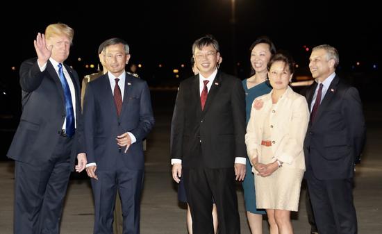 US President Donald Trump and his team arrive at the Singapore Paya Lebar Air Base Sunday evening.[Photo provided by Ministry of Communications and Information, Republic of Singapore]