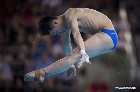 Chen Aisen of China competes during the men's 10m platform final at the FINA Diving World Cup 2018 in Wuhan, central China's Hubei Province on June 10, 2018. Chen claimed the title with a total of 557.80 points. (Xinhua/Xiao Yijiu)