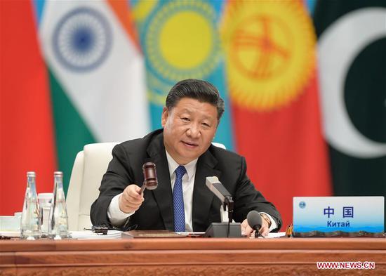 Chinese President Xi Jinping chairs the 18th Meeting of the Council of Heads of Member States of the Shanghai Cooperation Organization (SCO) in Qingdao, east China's Shandong Province, June 10, 2018. Xi delivered a speech during the meeting. (Xinhua/Li Xueren)