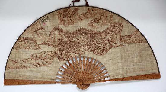 A traditional Rongchang folding fan made of local ramie fabric. (Photo/China Today)