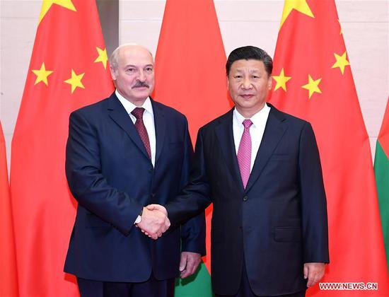 Chinese President Xi Jinping (R) meets with Belarusian President Alexander Lukashenko in Qingdao, east China's Shandong Province, June 10, 2018. (Xinhua/Yan Yan)