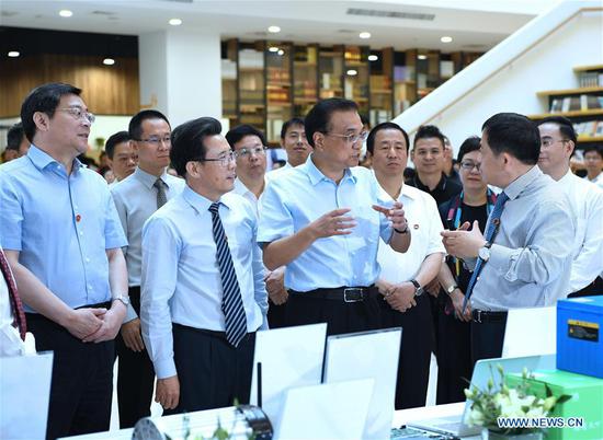 Chinese Premier Li Keqiang visits a start-up incubator of Sany Group in Changsha, capital of central China's Hunan Province, June 12, 2018. The visit is part of his two-day inspection trip to the cities of Hengyang and Changsha, which ended Tuesday. (Xinhua/Rao Aimin)