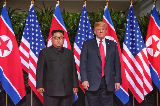 Top leader of the Democratic People's Republic of Korea (DPRK) Kim Jong Un (L) meets with U.S. President Donald Trump in Singapore, on June 12, 2018. (Xinhua/The Straits Times)