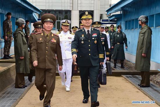 Maj. Gen. Kim Do-gyun (R front), a senior-level official of the defense ministry in charge of inter-Korean military affairs of South Korea, arrives at the border village of Panmunjom, on June 14, 2018.  (Xinhua/Defense Ministry of South Korea)