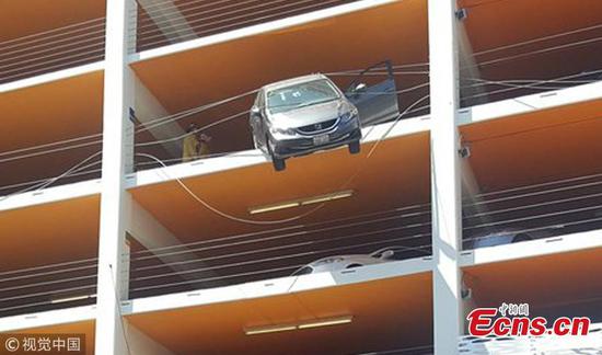 60-year-old rescued from car dangling off parking lot