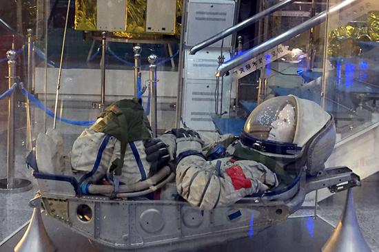 An image of an astronaut in the space capsule in the display hall at China Academy of Space Technology in Beijing, Nov. 21, 2017. (Photo by Tan Xinyu/chinadaily.com.cn)