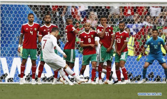Cristiano Ronaldo (front) of Portugal scores a penalty kick during a Group B match between Portugal and Morocco at the 2018 FIFA World Cup in Moscow, Russia, June 20, 2018. Portugal won 1-0. (Xinhua/Cao Can)