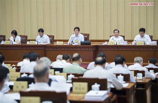 Li Zhanshu (C), chairman of the National People's Congress (NPC) Standing Committee, attends the second plenary meeting of a bimonthly session of the 13th NPC Standing Committee at the Great Hall of the People in Beijing, capital of China, June 20, 2018. (Xinhua/Li Tao)