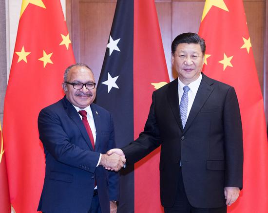 Xi meets with Papua New Guinean Prime Minister Peter O'Neill at the Diaoyutai State Guesthouse in Beijing. (Photo/Xinhua)