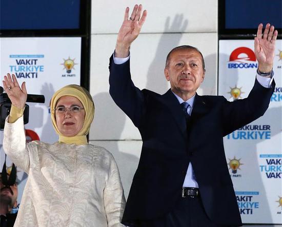 urkish President Recep Tayyip Erdogan greets his supporters with his wife on a rally in front of the Justice and Development Party (AKP) headquarters in Ankara, Turkey, on June 25, 2018.  (Xinhua/Mustafa Kaya)