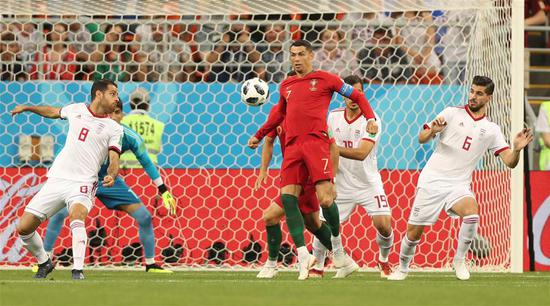Cristiano Ronaldo (C) of Portugal competes during the 2018 FIFA World Cup Group B match between Iran and Portugal in Saransk, Russia, June 25, 2018. (Xinhua/Fei Maohua)