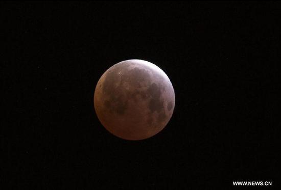 Photo taken on April 4, 2015 shows a total lunar eclipse observed in Tijuana, Baja California, in the northwest of Mexico. (Photo: Xinhua/Guillermo Arias)