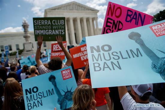 People protest against Supreme Court's ruling regarding Trump's travel ban