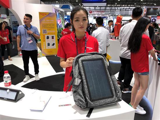 Hanergy showcases their solar-power backpack (Photo/Shine.cn)