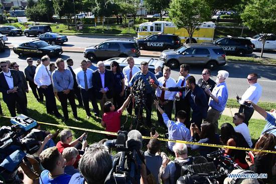 A police officer speaks to the media near the scene of a mass shooting in Annapolis, the capital city of eastern U.S. state Maryland, on June 28, 2018. (Xinhua/Yang Chenglin)