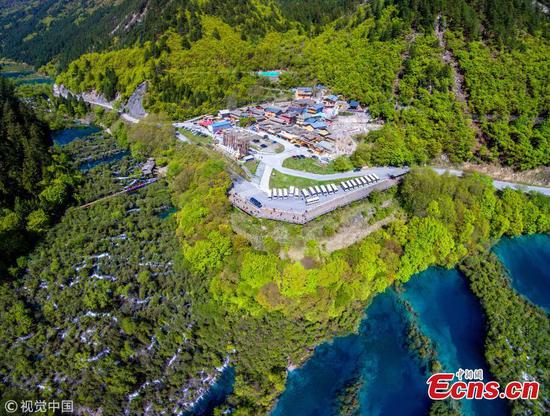 Photos taken on May 3 and 4 show the superb mountainous landscape and stunning scenery at the UNESCO World Heritage Site Jiuzhai Valley which reopens gradually after a 7.0-magnitude earthquake struck the popular tourist destination last August. The park will reopen partially as the restoration will be completed in three years. (Photo/VCG)