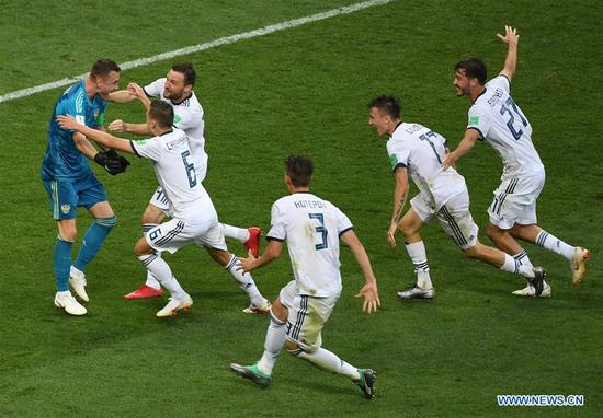 Goalkeeper Igor Akinfeev (L) of Russia celebrates victory with teammates after the 2018 FIFA World Cup round of 16 match between Spain and Russia in Moscow, Russia, July 1, 2018. Russia won 5-4 (4-3 in penalty shootout) and advanced to the quarter-final. (Xinhua/Wang Yuguo)