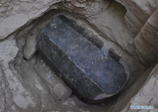 This undated photo provided by Egyptian Ministry of Antiquities shows a large black granite sarcophagus in Alexandria, Egypt. An Egyptian archeological mission discovered Sunday a tomb with a large black granite sarcophagus dating back to the Ptolemaic era in the Egyptian coastal province of Alexandria, the head of Egypt's Supreme Council of Antiquities (SCA) said in a statement. (Xinhua)