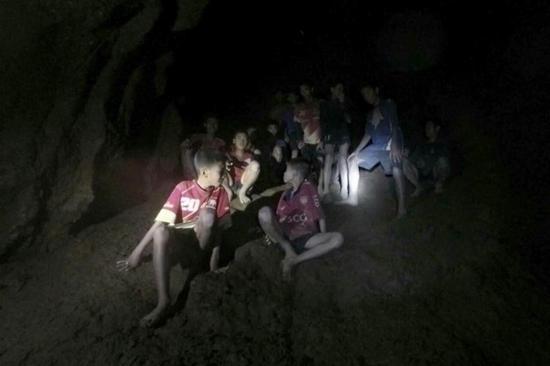 Photo provided by Thai Navy Seal shows trapped teenagers in a cave in Mae Sai, Chiang Rai province, northern Thailand, on July 2, 2018. Twelve teenagers and their football coach, trapped in a cave in northern Thailand for nine days, have been found alive on Monday night, Narongsak Osottanakorn, governor of Chiang Rai province said. (Xinhua)